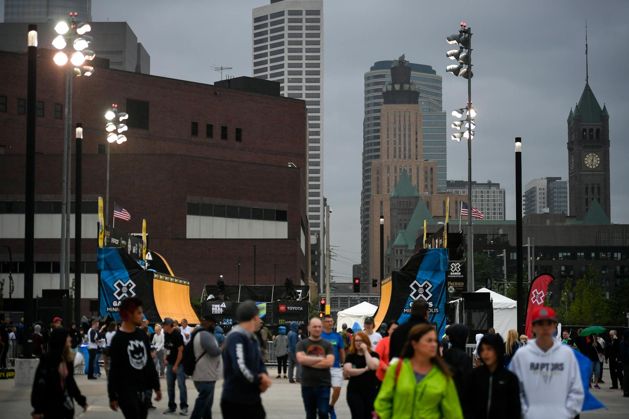 Fans walked away from the vert ramp Thursday as rain began to fall.