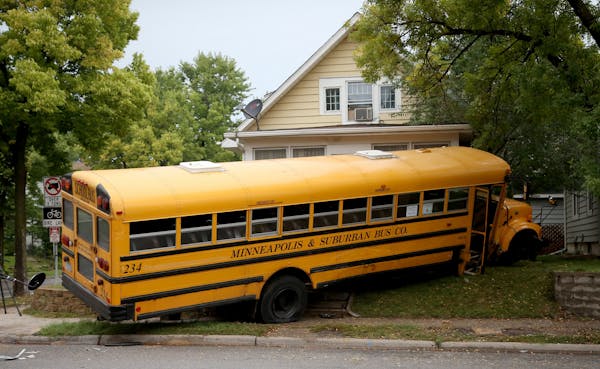 A schoo bus collided with another school bus and wound up crashing into the corner of the Rogers' home.