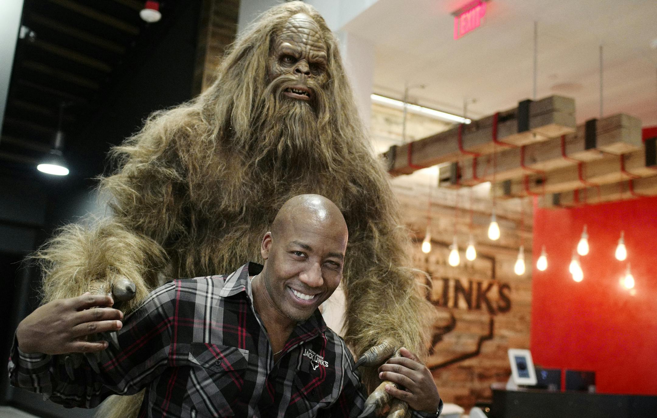 Chief Marketing Officer Tom Dixon poses with the company's famous mascot, Sasquatch.] Jerky maker Jack Link's has opened its new offices in Mayo Clinic Square.Richard Tsong-Taatariiïrtsong-taatarii@startribune.com