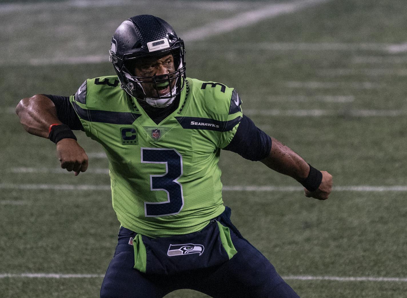 Seattle Seahawks quarterback Russell Wilson reacts after throwing the game winning touchdown during the second half an NFL football game against the Minnesota Vikings, Sunday, Oct. 11, 2020, in Seattle. The Seahawks won 27-26. (AP Photo/Stephen Brashear) ORG XMIT: NYOTK