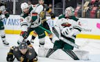 Minnesota Wild goaltender Cam Talbot (33) blocks a shot by the Vegas Golden Knights during the second period of an NHL hockey game Monday, May 24, 202