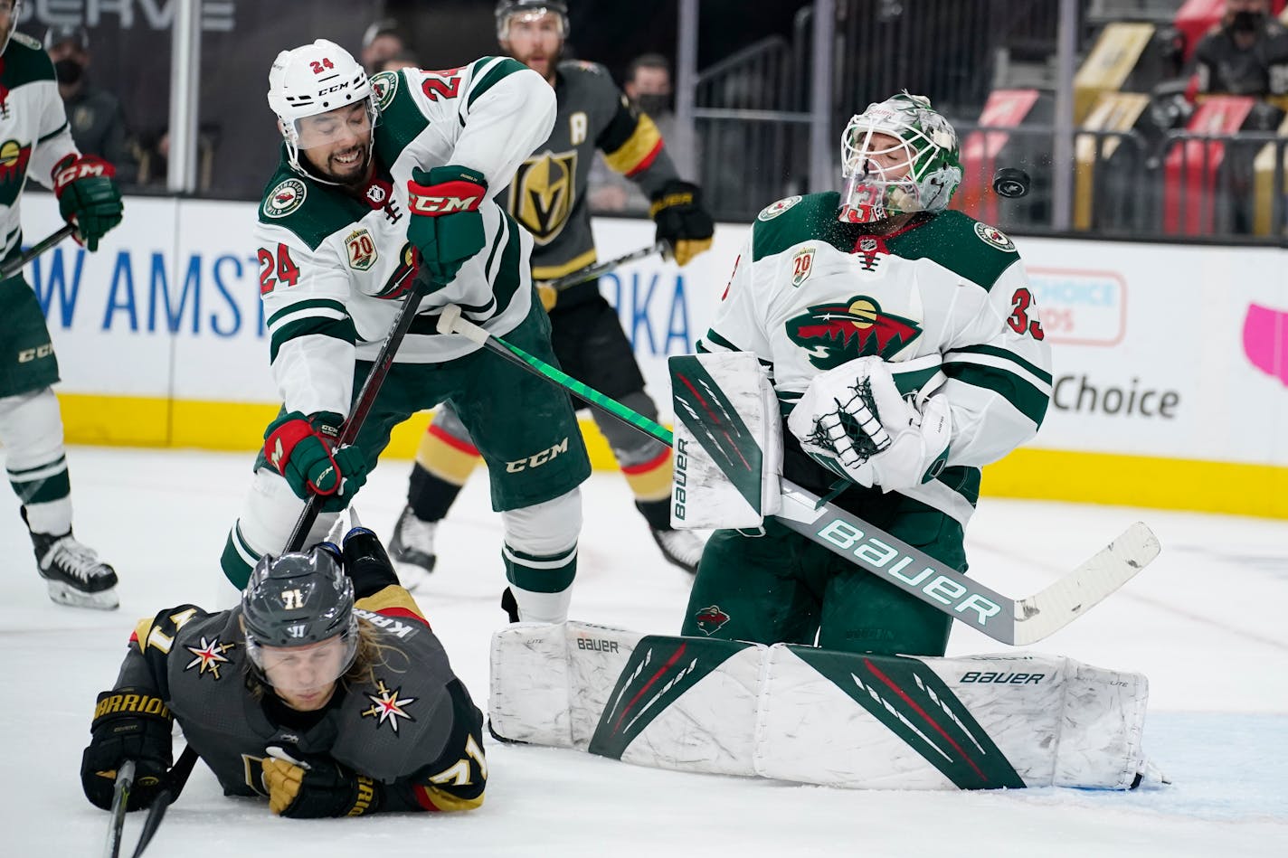 Minnesota Wild goaltender Cam Talbot (33) blocks a shot by the Vegas Golden Knights during the second period of an NHL hockey game Monday, May 24, 2021, in Las Vegas. (AP Photo/John Locher)