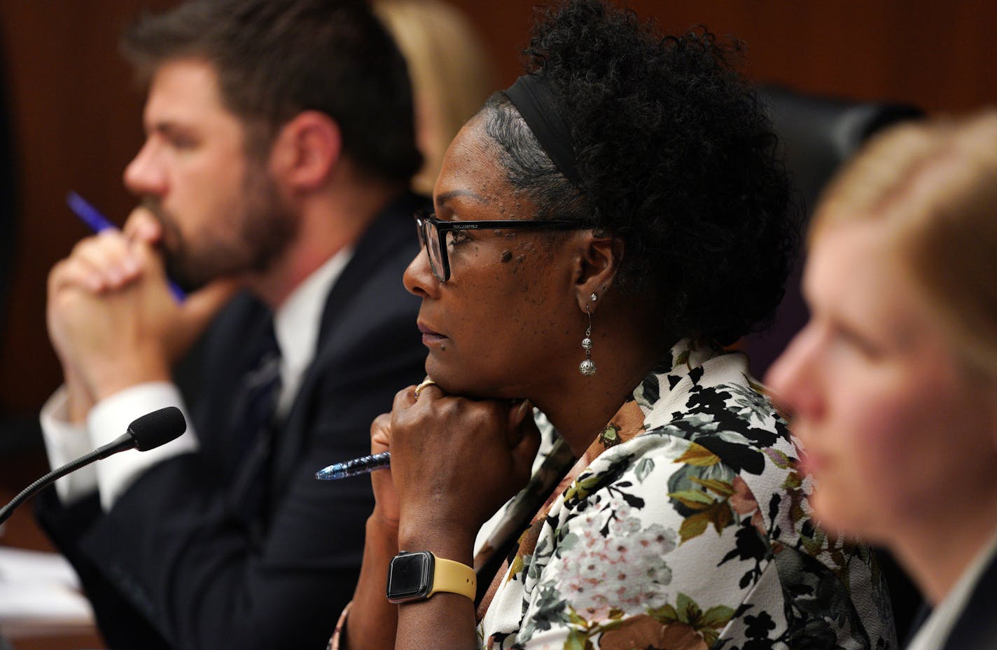 Rep. Rena Moran, DFL-St. Paul, chair of the Health and Human Services Policy Committee, sat between committee administrator Chris McCall and committee legislative aide Alyssa Fritz as Rep. Mike Freiberg, DFL-Golden Valley, spoke about his proposed End-of-Life Options Act on Wednesday.