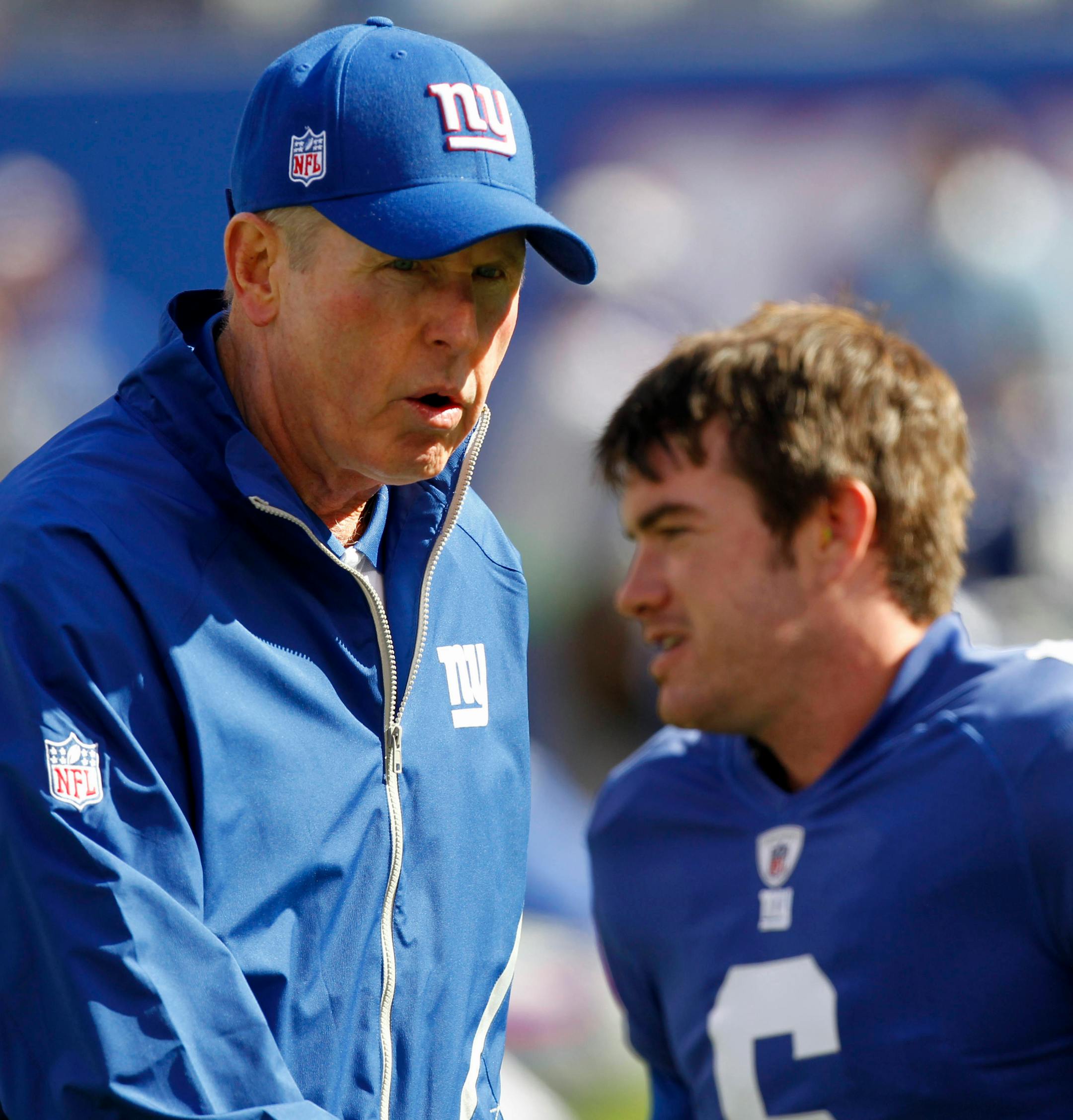 FILE - In this file photo taken Oct. 17, 2010, New York Giants head coach Tom Coughlinm, left, talks to punter Matt Dodge before an NFL football game against the Detroit Lions at New Meadowlands Stadium in East Rutherford, N.J. The Giants' rookie punter was front and center on every sports highlight show on Sunday night, Dec. 19 with Coughlin in his face, ripping him for failing to kick the ball out of bounds on DeSean Jackson's game-ending 65-yard punt return in the NFC East showdown with the P