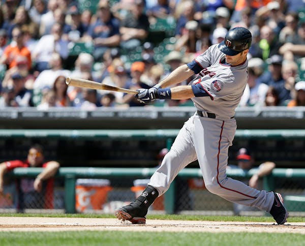Minnesota Twins' Joe Mauer bats during the first inning of a baseball game against the Detroit Tigers in Detroit, Saturday, May 10, 2014. (AP Photo/Ca