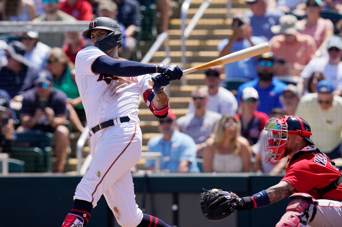 Minnesota Twins shortstop Carlos Correa watches his hit in the first inning during a spring training baseball game against the Boston Red Sox at Hammond Stadium Sunday, March 27, 2022, in Fort Myers, Fla. (AP Photo/Steve Helber)