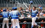 Heritage Christian Academy pitcher Seth Halvorsen, right, hit a three-run homer in the bottom of the fifth inning, his second of the game, against Sle