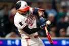 Twins shortstop Carlos Correa (4) swings the bat in the eighth inning against the Seattle Mariners on May 8.