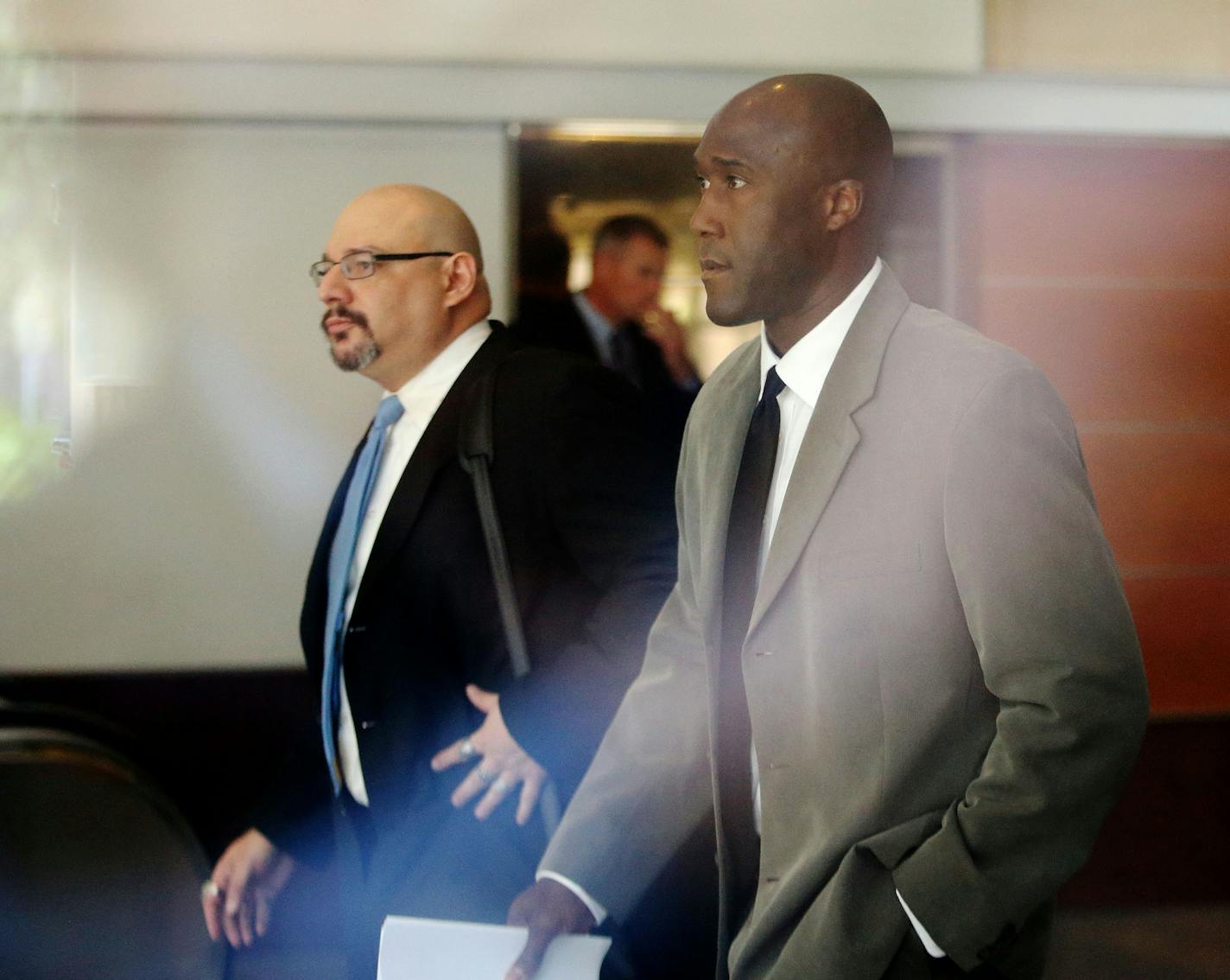 Minneapolis police officer Michael Griffin pleaded not guilty in his first appearance in federal court Thursday on charges of perjury, falsification of records and rights violations stemming from two incidents in 2010 and 2011. Griffin was accompanied by his attorney, Ryan Kaess as he left court and headed to a waiting vehicle Thursday, May 21, 2015, U.S. District Court in Minneapolis, MN.(DAVID JOLES/STARTRIBUNE)djoles@startribune.com Minneapolis police officer Michael Griffin makes his first c