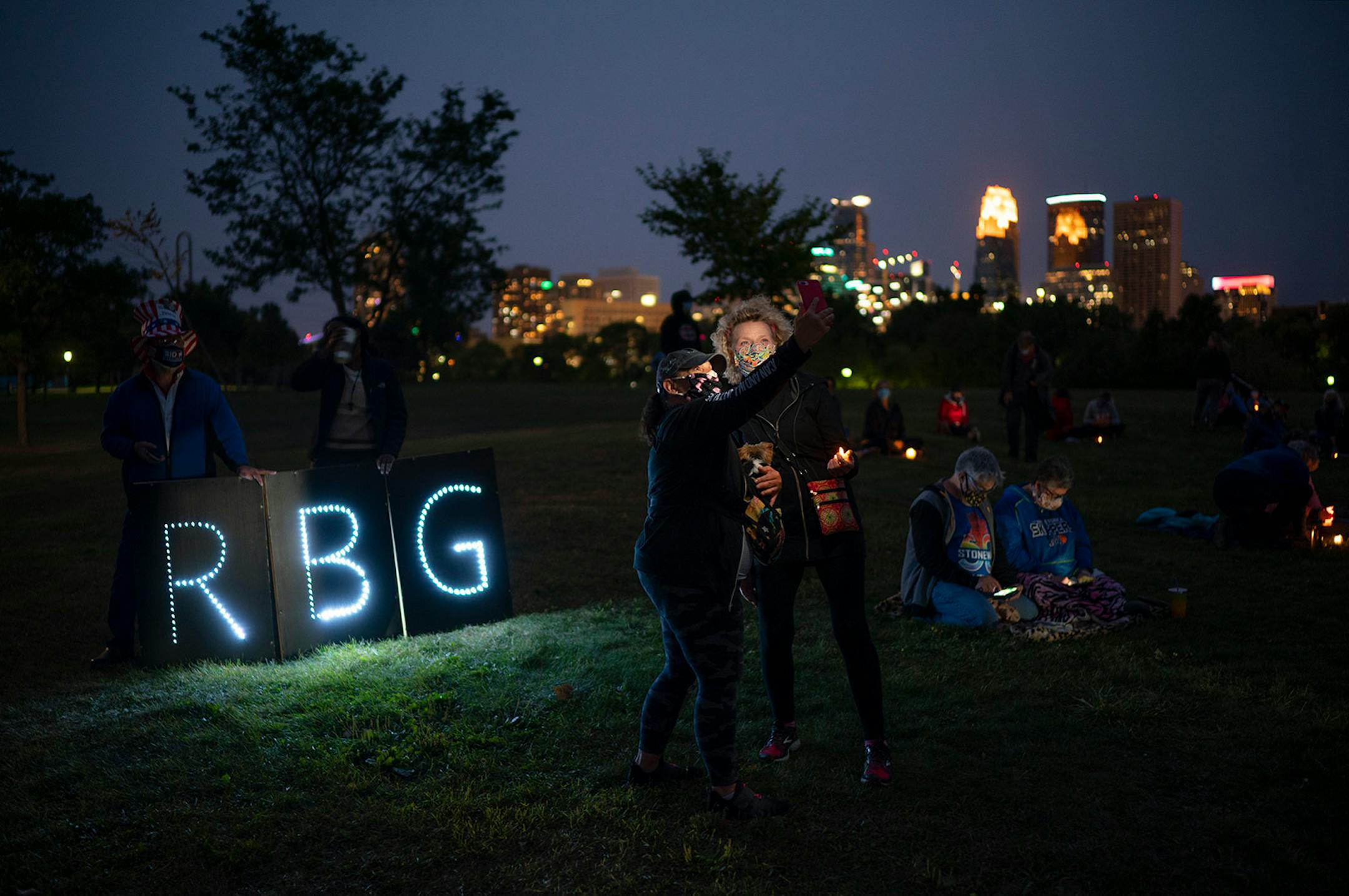Two people took a selfie in front of Ruth Bader Ginsberg�s initials as the program began.