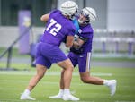 Vikings guard Dalton Risner, right, runs through drills with Doug Nester (72) during practice at TCO Performance Center in Eagan on Friday.