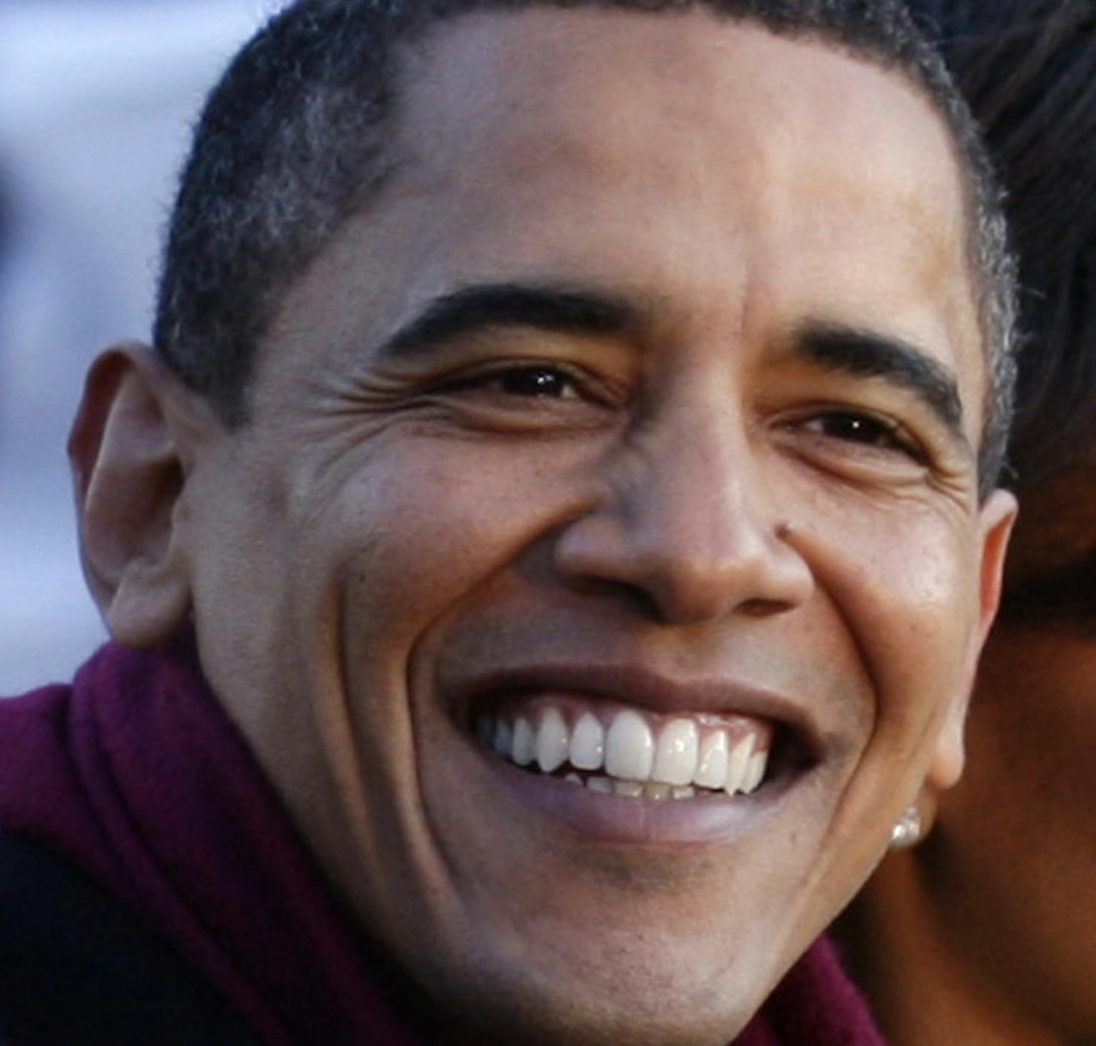 President Barack Obama and wife, Michelle, walk along the parade route after he was sworn in as the 44th US President in Washington, D.C., on Tuesday, January 20, 2009. (Chuck Kennedy/MCT)