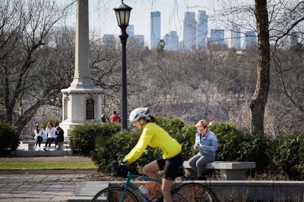 Bikers, joggers and pedestrians struggled to keep their distance as they enjoyed the sun and warm temperatures near the Monument on the west end of Su