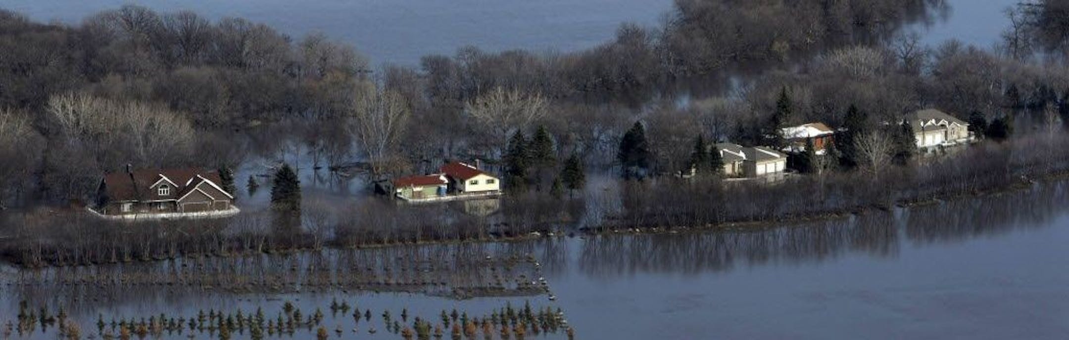 Houses sit isolated by floodwaters during March 2009 flooding along the Red River, south of Fargo.