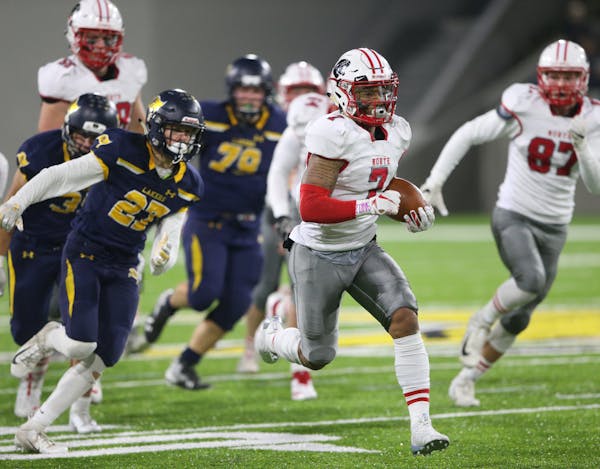 Lakeville North running back Raja Nelson (7) headed for the end zone against Prior Lake during a long first-quarter TD run Friday at TCO Stadium in Ea
