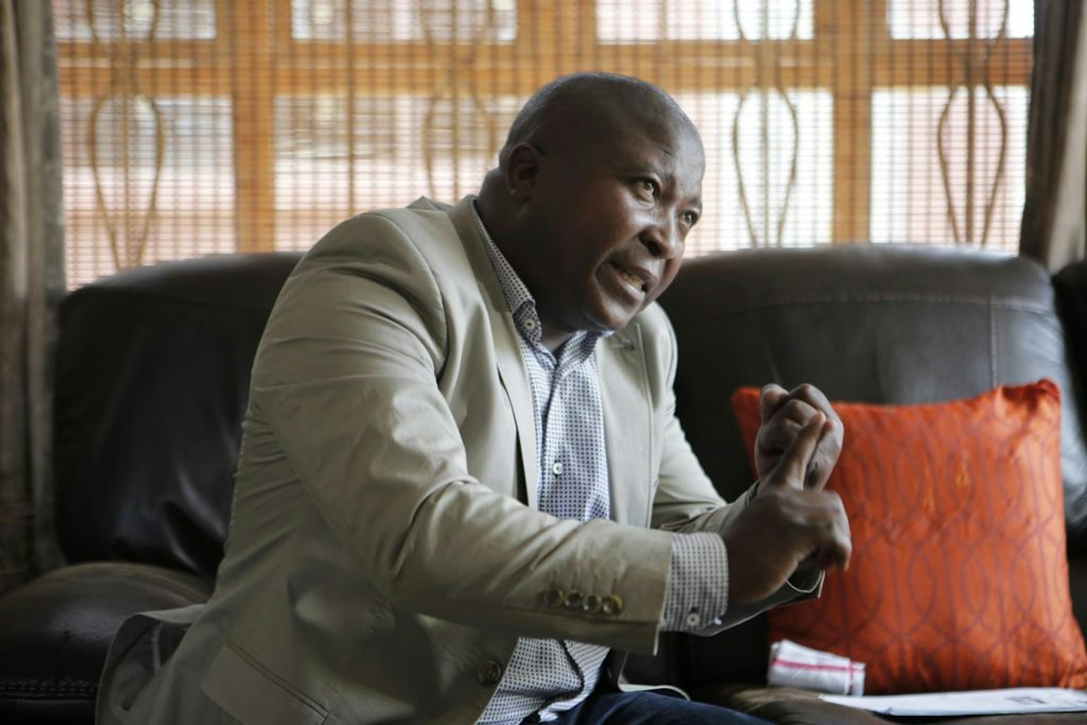 Thamsanqa Jantjie gestures at his home during an interview with the Associated Press in Johannesburg, South Africa,Thursday, Dec. 12, 2013.
