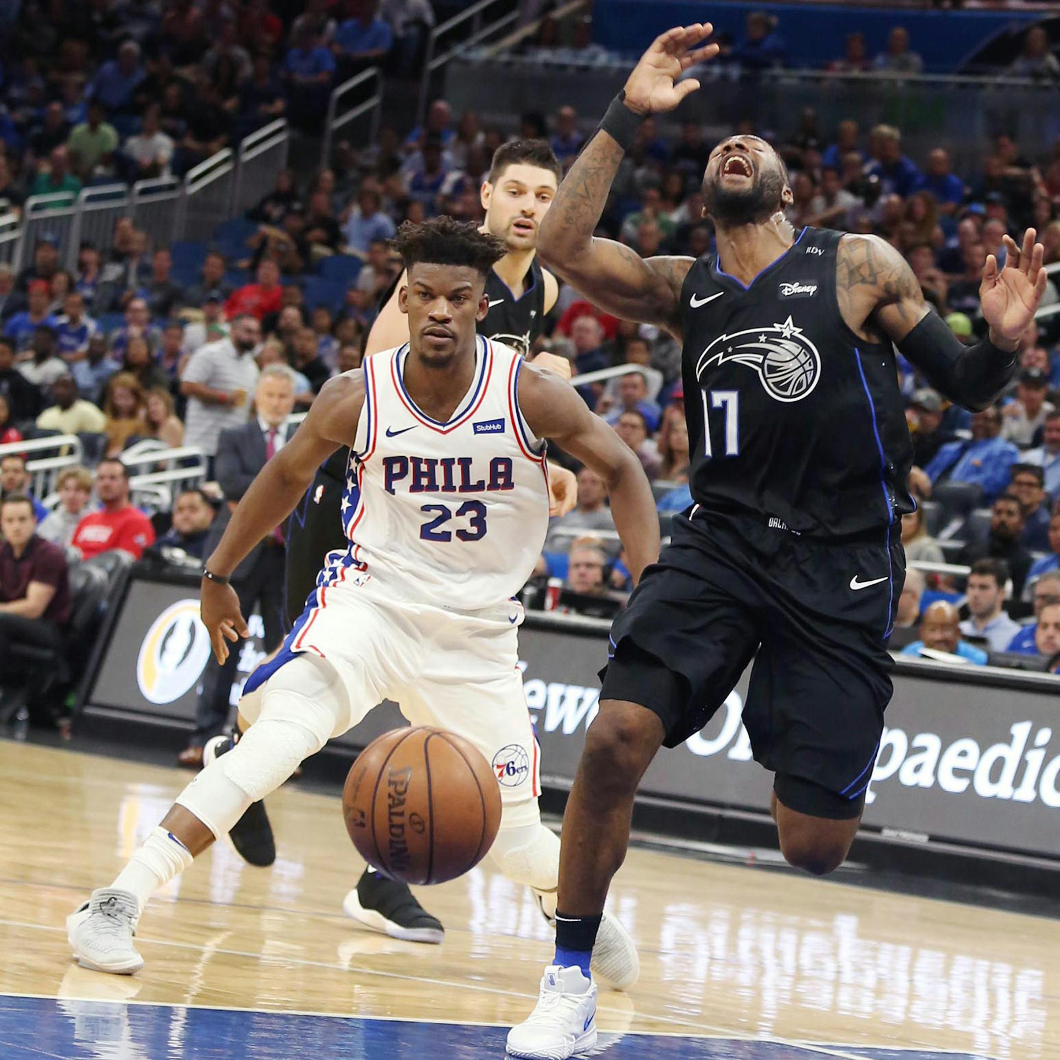 The Orlando Magic's Jonathon Simmons (17) screams as he is fouled by the Philadelphia 76ers' Jimmy Butler (23) at the Amway Center in Orlando, Fla., on Wednesday, Nov. 14, 2018. (Stephen M. Dowell/Orlando Sentinel/TNS)
