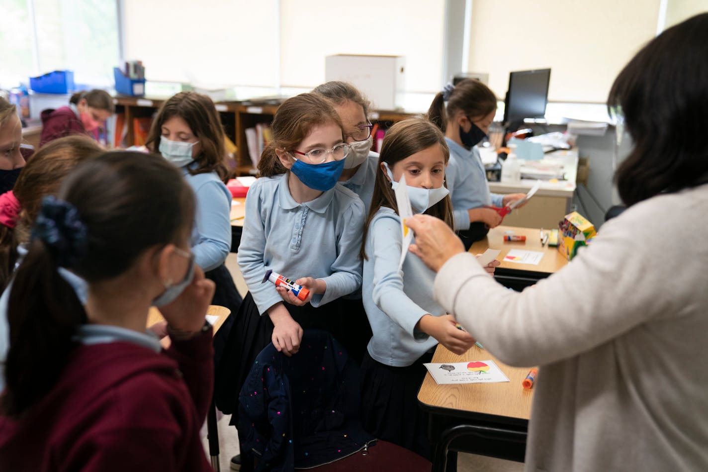 Fourth grade girls in teacher Nechama Idstein's class made prayer cards with cut outs of traditional foods for Rosh Hashana meals during class at Torah Academy in St. Louis Park, Minn., on Thursday, September 17, 2020.