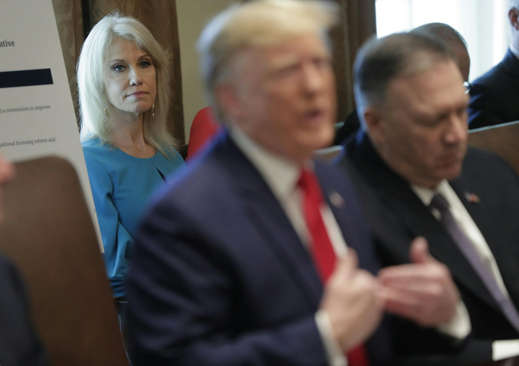 Counselor to the President Kellyanne Conway, left, listens to President Donald Trump, center, speak during a Cabinet meeting in the Cabinet Room of the White House, Monday, Oct. 21, 2019, in Washington. On the far right is Secretary of State Mike Pompeo. (AP Photo/Pablo Martinez Monsivais)