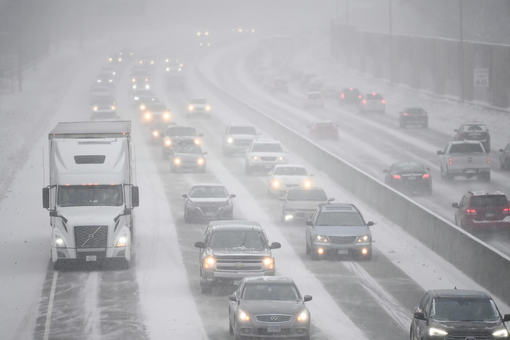 Traffic along Highway 100 in St. Louis Park during Tuesday afternoon's snow storm.