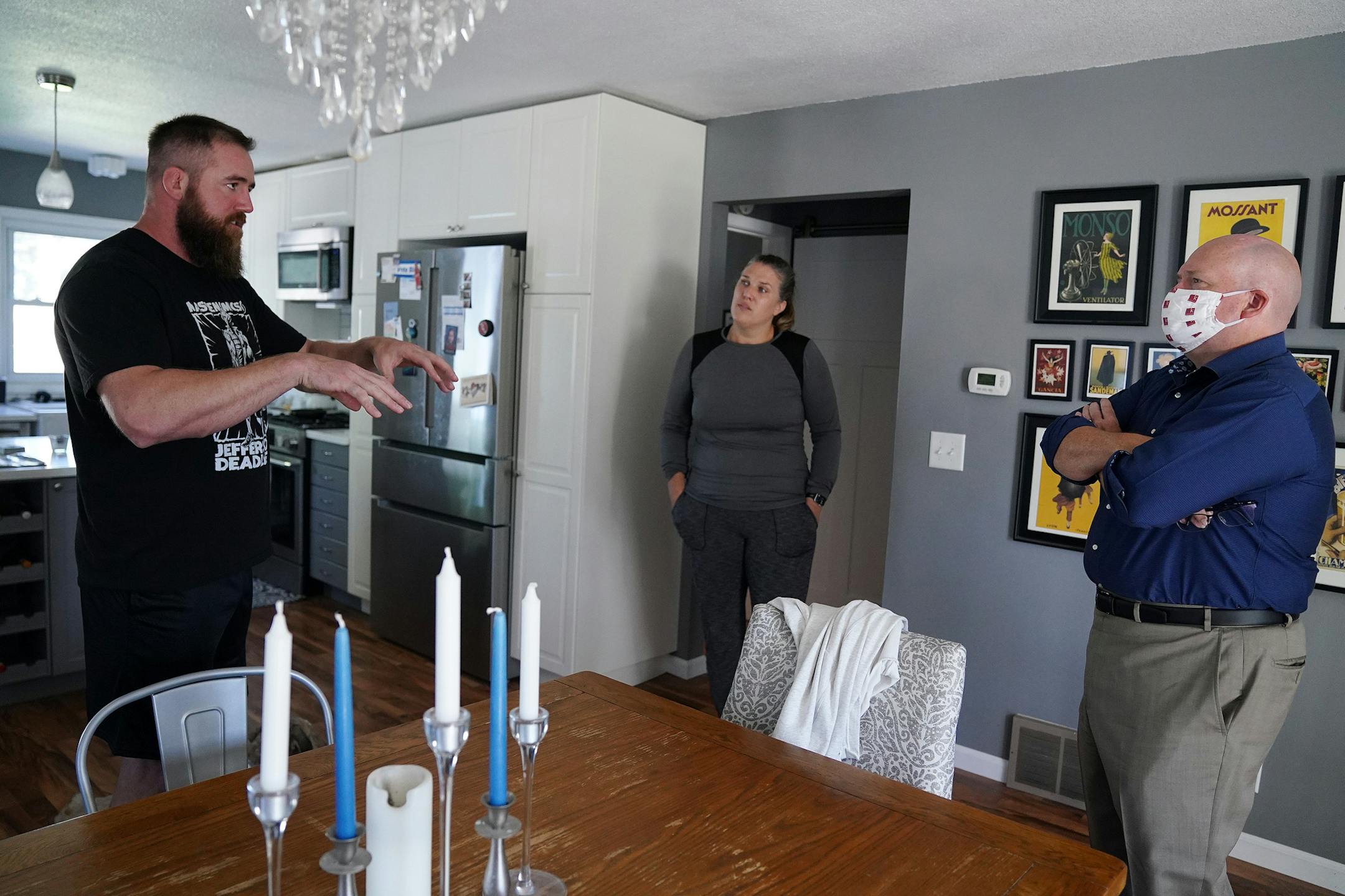 Cecilia Mische and her fiancé Grant Thompson talked with real estate agent Shawn Korby about the possibility of selling their home Tuesday in northeast Minneapolis. ] ANTHONY SOUFFLE • anthony.souffle@startribune.com Cecilia Mische and her fiancé Grant Thompson talked with real estate agent Shawn Korby about the possibility of selling their home Tuesday, Aug. 18, 2020 in northeast Minneapolis. House listings in the Twin Cities are declining while sales are on the rise in both the cities and the