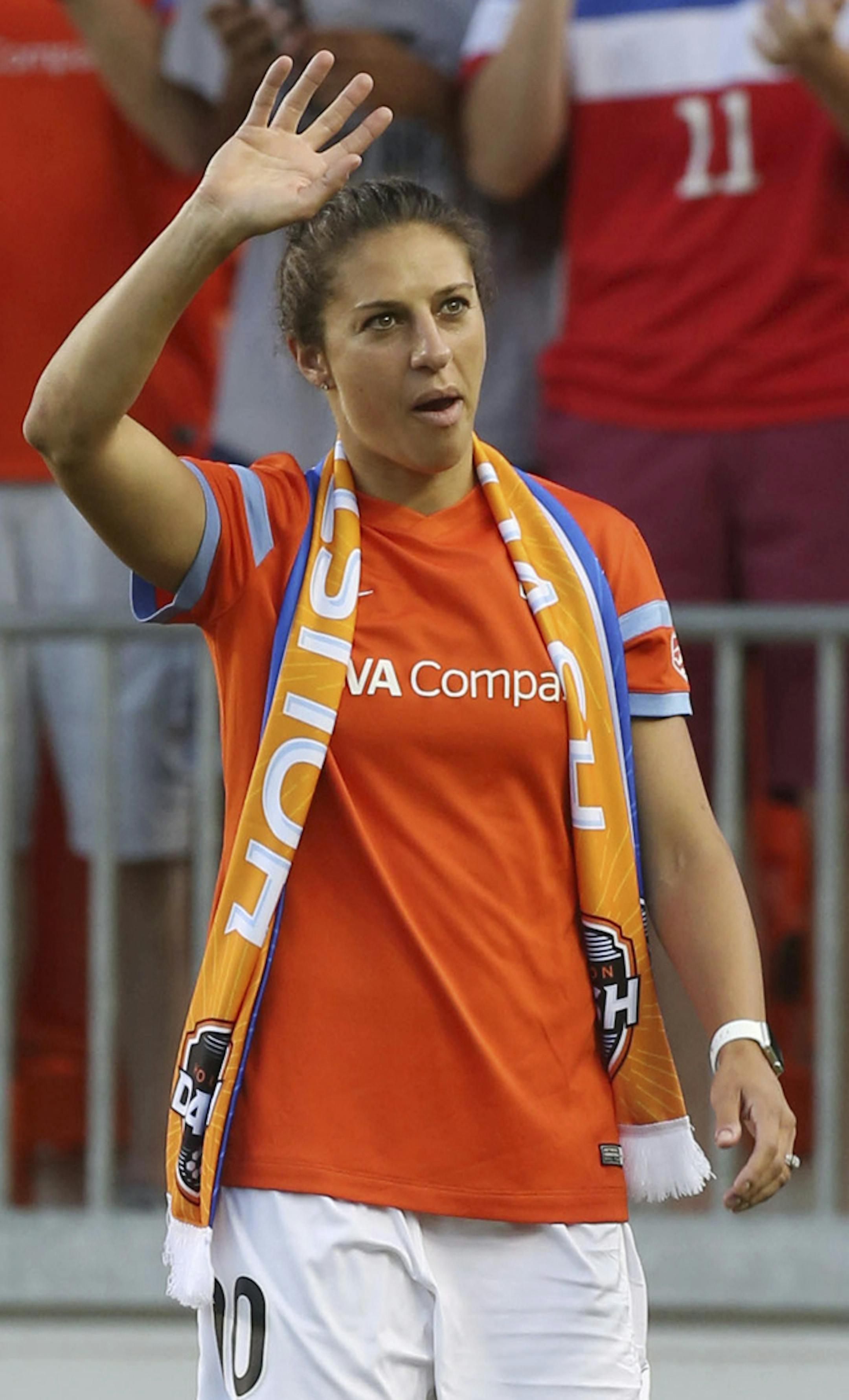FILE - In this July 12, 2015, file photo, Houston Dash midfielder Carli Lloyd (10), a member of the world champion United States women's soccer team, waves to a cheering stadium as she returns to Houston before the Houston Dash and Chicago Red Stars game at BBVA Compass Stadium, in Houston. Carli Lloyd penned a letter of thanks to the Houston Dash in the wake of a three-team trade in the National Womenís Soccer League that sent her to Sky Blue FC. Sky Blue acquired Lloyd in a draft-day trad