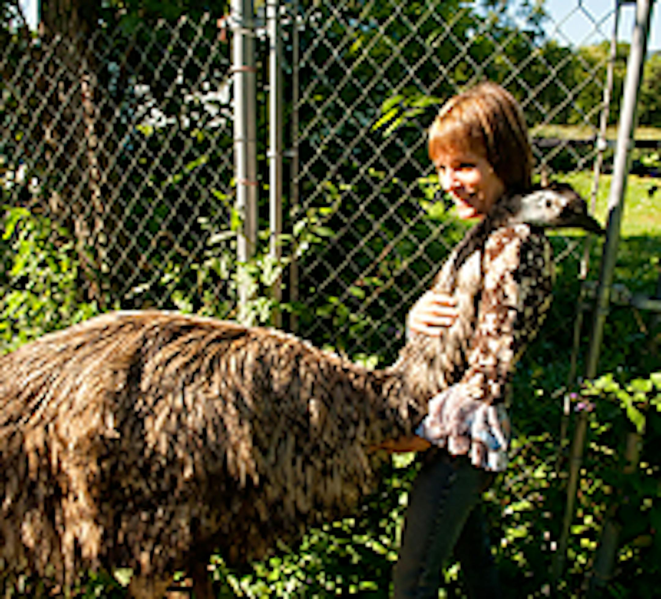 Mary Lakner with a friend at the Hassu Lintu emu farm
