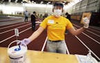 Volunteer Lauren Burroughs made sure this particular station was sanitized for the next person. At the U of MN Field House, about 2,000 students, staf