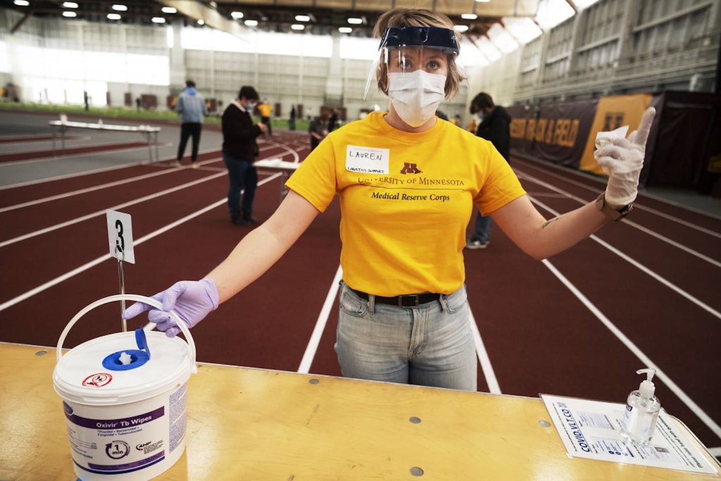 Volunteer Lauren Burroughs made sure this particular station was sanitized for the next person. At the U of MN Field House, about 2,000 students, staff, and faculty took saliva COVID-19 tests before the university locks down and goes to virtual learning for the rest of the semester.