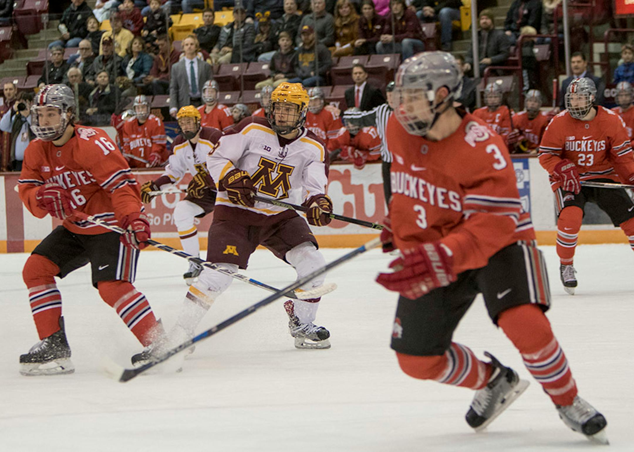 Ohio State Buckeyes forward Matthew Weis (16), Ohio State Buckeyes defenseman Sasha Larocque (3) and Minnesota Golden Gophers forward Leon Bristedt (18) follow the puck as the Minnesota Golden Gophers hosted the Ohio State Buckeyes to open the Big Ten Conference schedule on December 4, 2015. ] Special to Star Tribune MATT BLEWETT ï matt@mattebphoto.com - December 4, 2015, Minneapolis, MN, Big Ten Hockey, Minnesota Golden Gophers vs. Ohio State Buckeyes, 257622 UPUK 120415