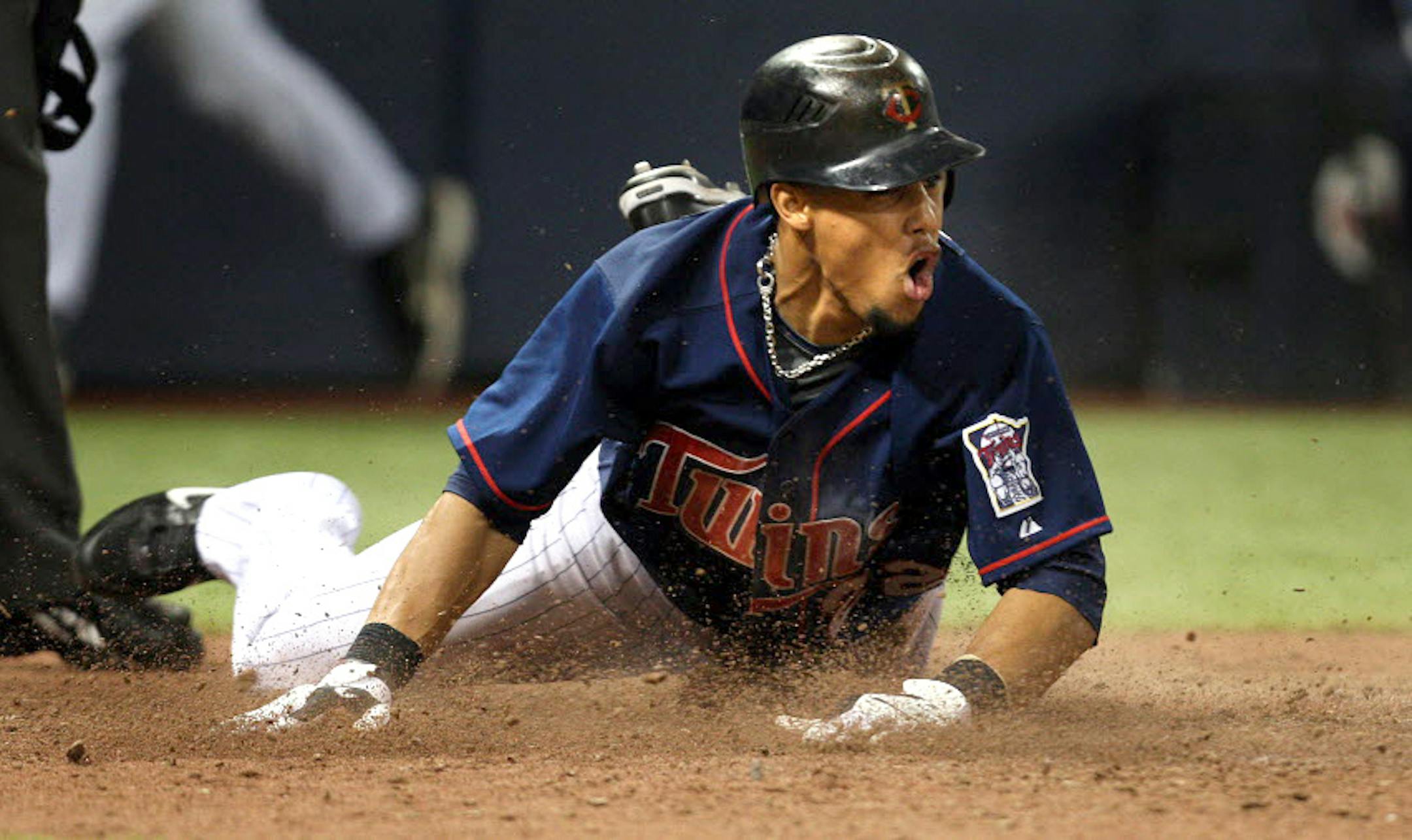 Carlos Gomez scored the tying run in the eighth inning.