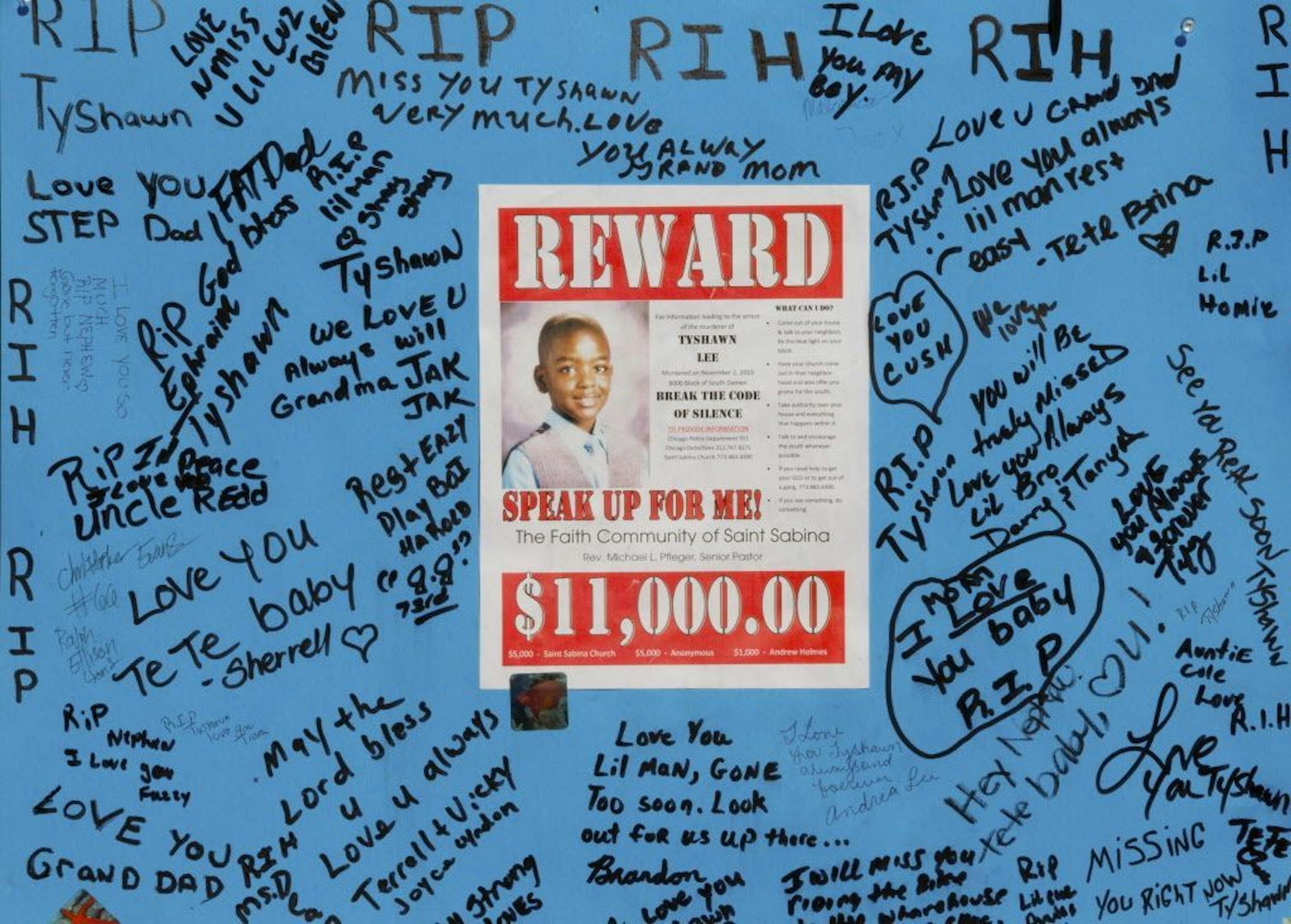 FILE - In this Nov. 4, 2015 file photo, a reward sign and messages hang near the site where 9-year-old Tyshawn Lee was fatally shot Nov. 2 in Chicago. On Thursday, March 7, 2016, Dwight Boone-Doty, 22, was charged with first-degree murder in Tyshawn's death. Police say the boy was lured from a playground and shot in the head because of his father's gang ties.