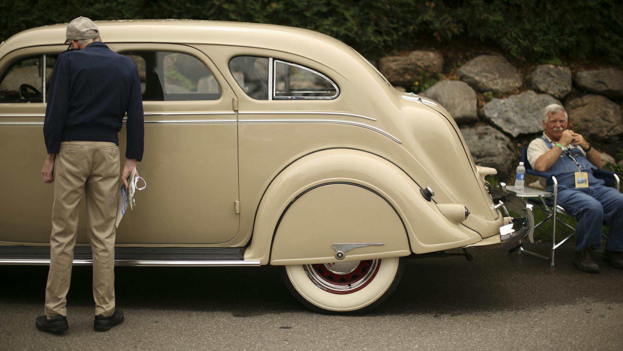 Greg Biskey sat by his 1936 Chrysler Imperial Airflow at the 10,000 Lakes Concours d'Elegance Sunday afternoon. He said it didn't need much work when he got it, but the motor was siezed up. "It's a very rare car," he said. "They're not a lot of Airflows around." ] JEFF WHEELER ‚Ä¢ jeff.wheeler@startribune.com The second annual 10,000 Lakes Concours d'Elegance was held Sunday afternoon in Excelsior. The Concours d'Elegance, French for "Competition of Elegance," is a gathering of