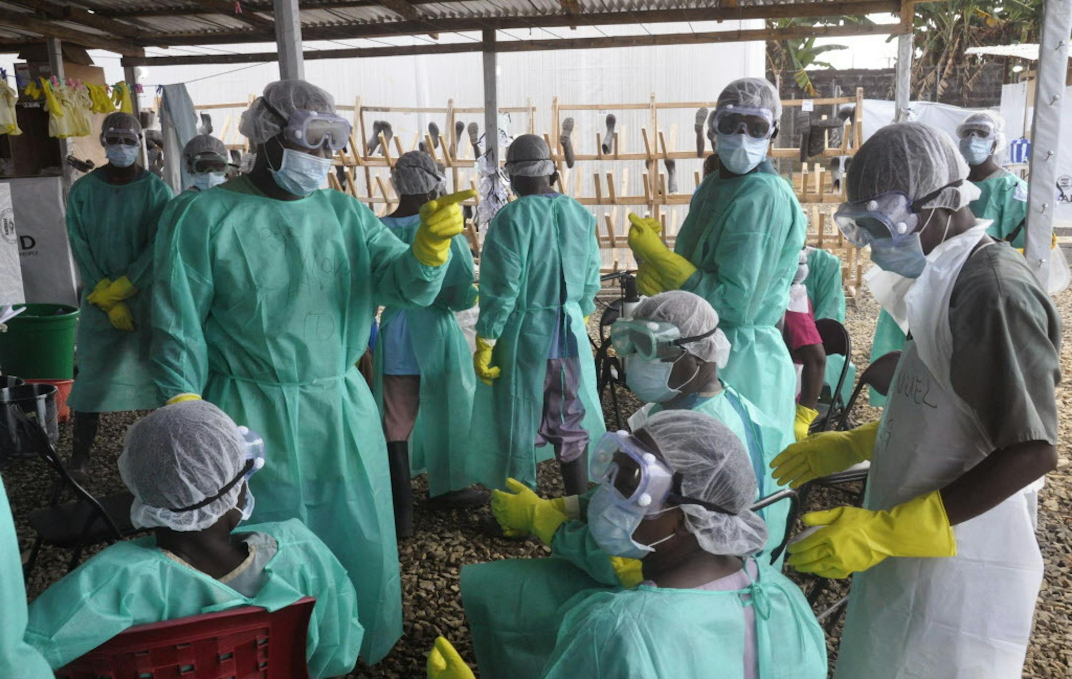 Health care workers inside a USAID, funded Ebola clinic with their Ebola virus protective gear in Monrovia, Liberia, Friday, Jan. 30, 2015. The World Health Organization says officials are now focused on ending the biggest-ever Ebola outbreak rather than just slowing the virusí spread. In an update published Thursday, Jan. 29, 2015, the U.N. health agency said the three most affected countries _ Guinea, Sierra Leone and Liberia _ reported fewer than 100 cases in the past week, for the first