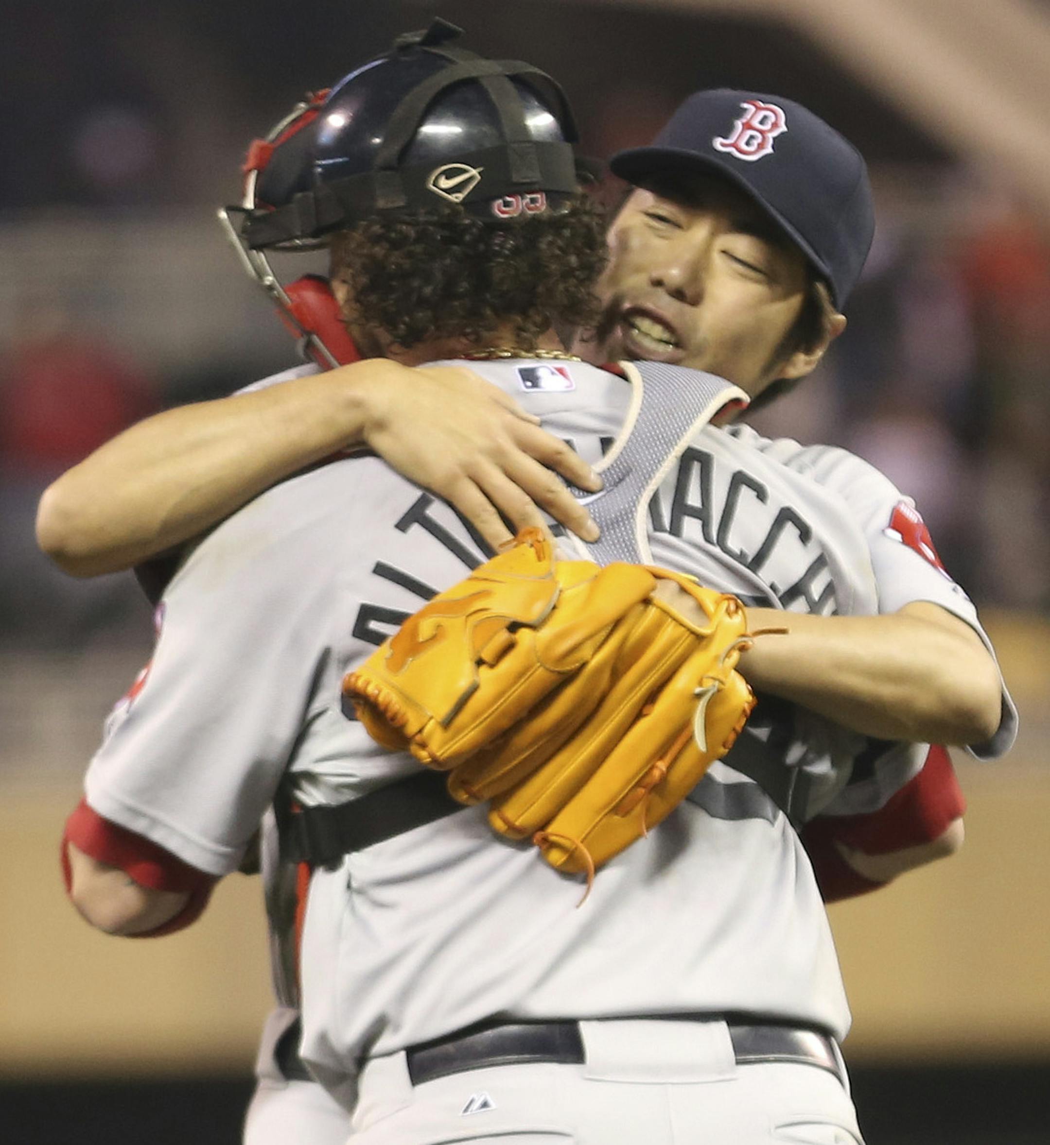 Red Sox pitcher Koji Uehara celebrated with teammate Jarrod Saltalamacchia after getting the save at Target Field in Minneapolis, Min., Friday, May 17, 2013 Red Sox won in the 10th 3-2 over the Twins ] (KYNDELL HARKNESS/STAR TRIBUNE) kyndell.harkness@startribune.com