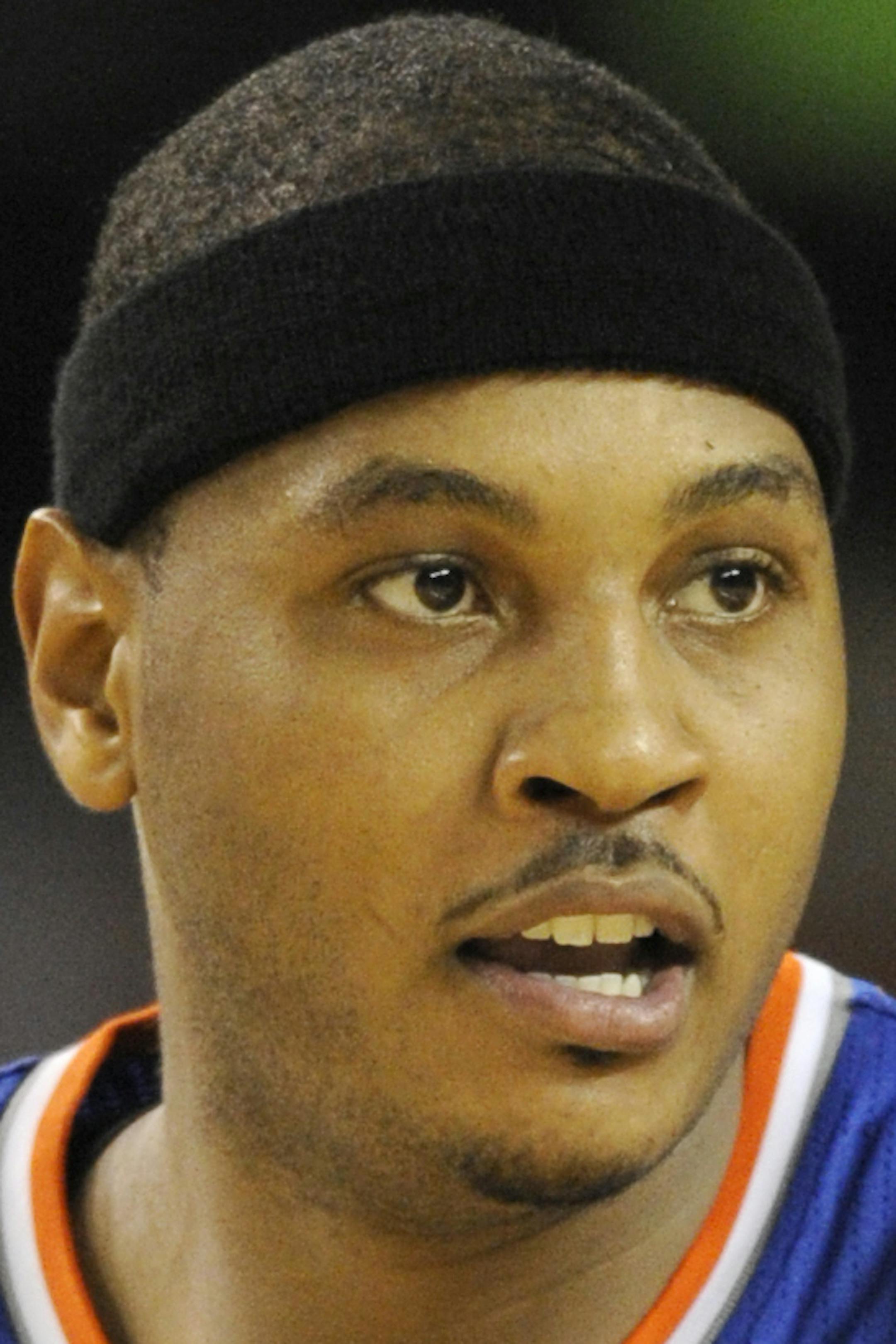 New York Knicks forward Carmelo Anthony (7) looks on against the Washington Wizards during the first half of an NBA preseason basketball game, Thursday, Oct. 17, 2013, in Baltimore. (AP Photo/Nick Wass) ORG XMIT: OTKNY