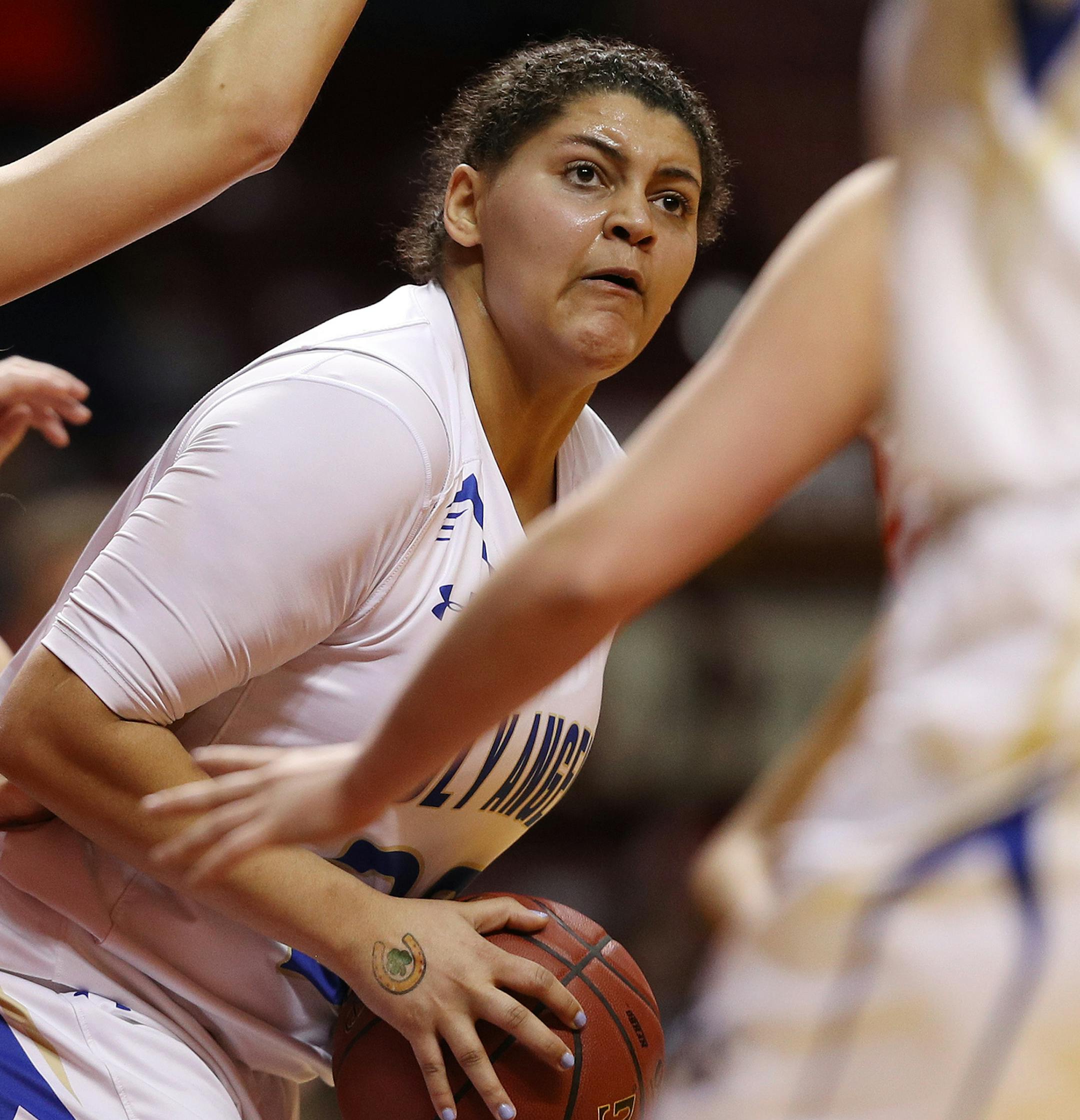Academy of Holy Angels' Destinee Oberg (23) grabbed a rebound as Winona's Eden Nibbelink (12) pressured her in the first half. ] ANTHONY SOUFFLE ï anthony.souffle@startribune.com Players competed during the girls' basketball state tournament Class 3A semifinal games Thursday, March 16, 2017 at Williams Arena on the grounds of the University of Minnesota in Minneapolis.
