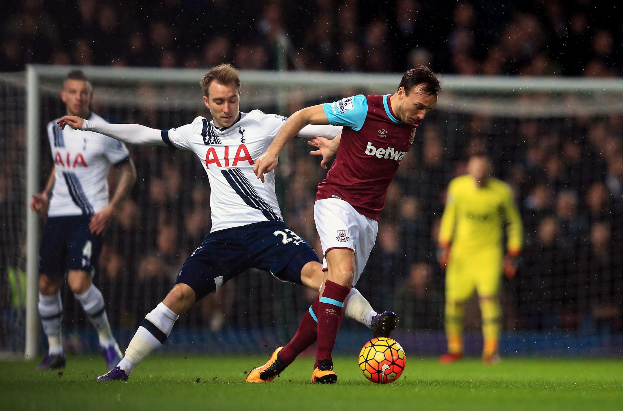 Tottenham Hotspur's Christian Eriksen, left, and West Ham United's Mark Noble battle for the ball during the English Premier League match between Tottenham Hotspur and West Ham at Upton Park, London, Wednesday March 2, 2016.