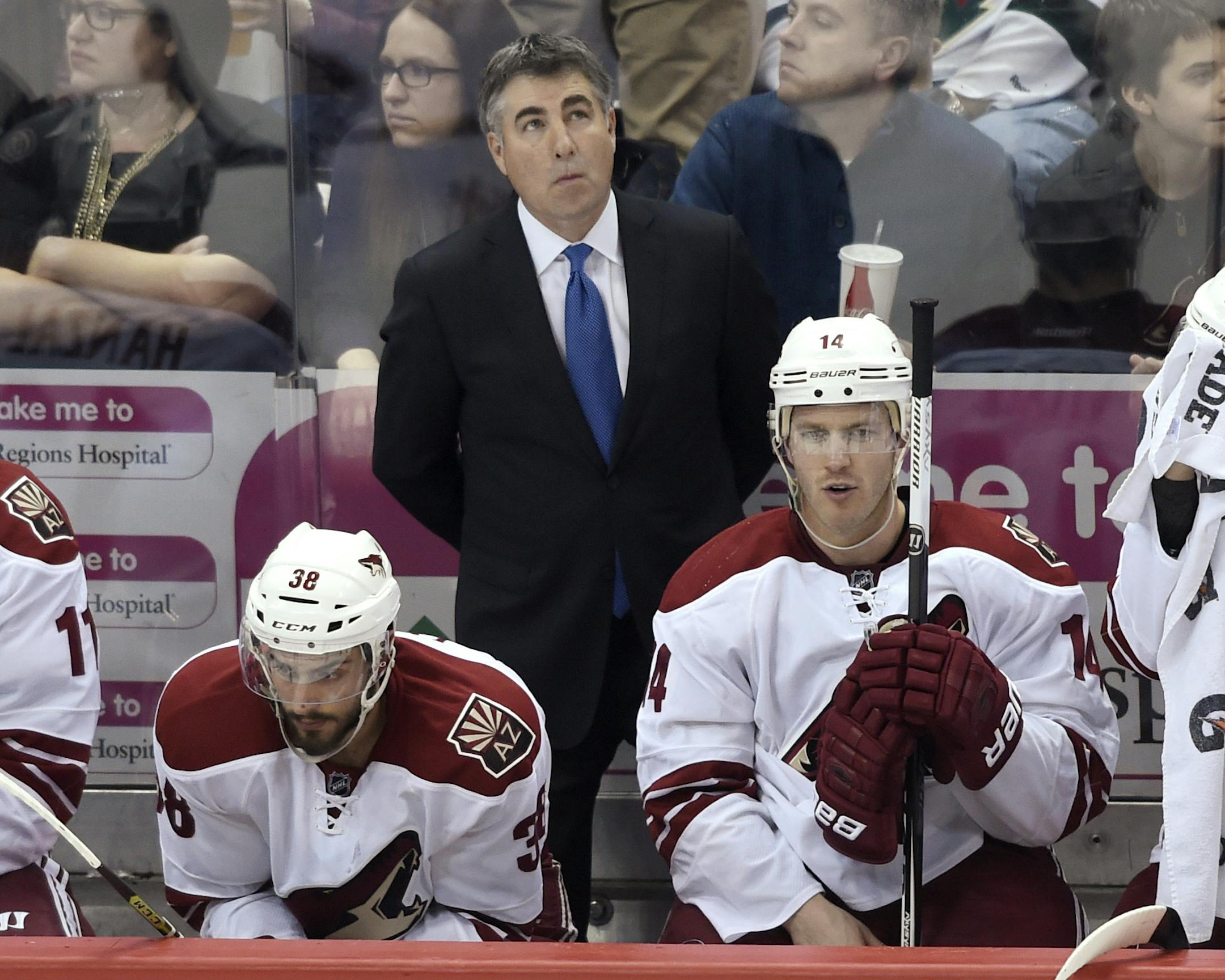Arizona Coyotes coach Dave Tippett watches during the third period of his team's NHL hockey game against the Minnesota Wild Saturday, Jan. 17, 2015, in St. Paul, Minn. The Wild won 3-1. (AP Photo/Hannah Foslien)