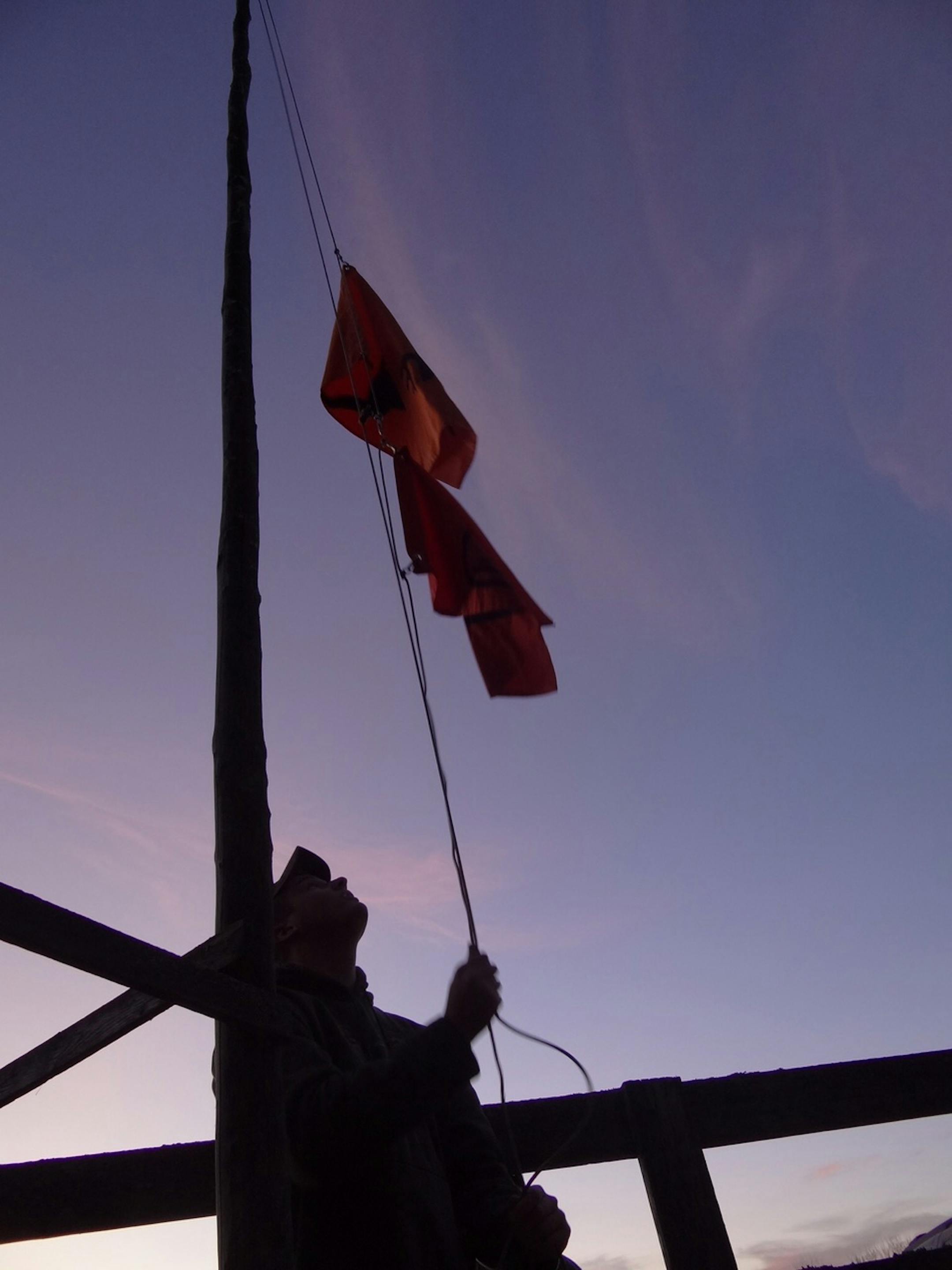 Flag-raising at the Tschida deer camp.