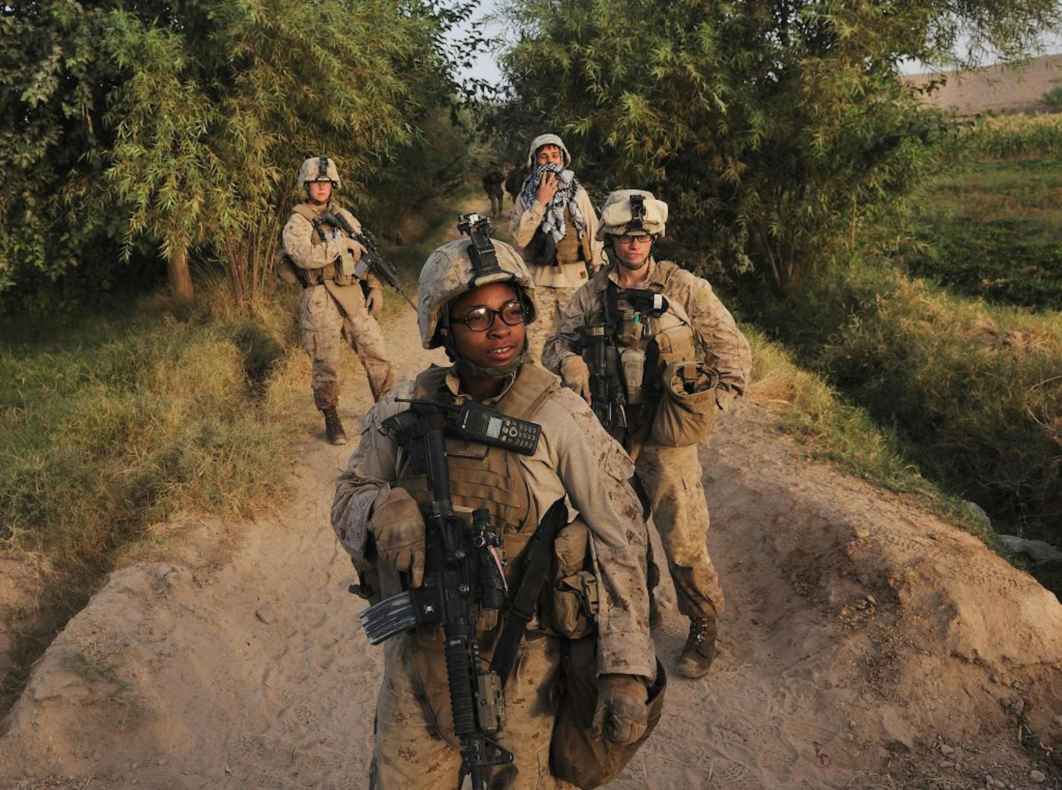 Cpl. Christina Oliver, center, during a patrol in Marja, Afghanistan in 2010.