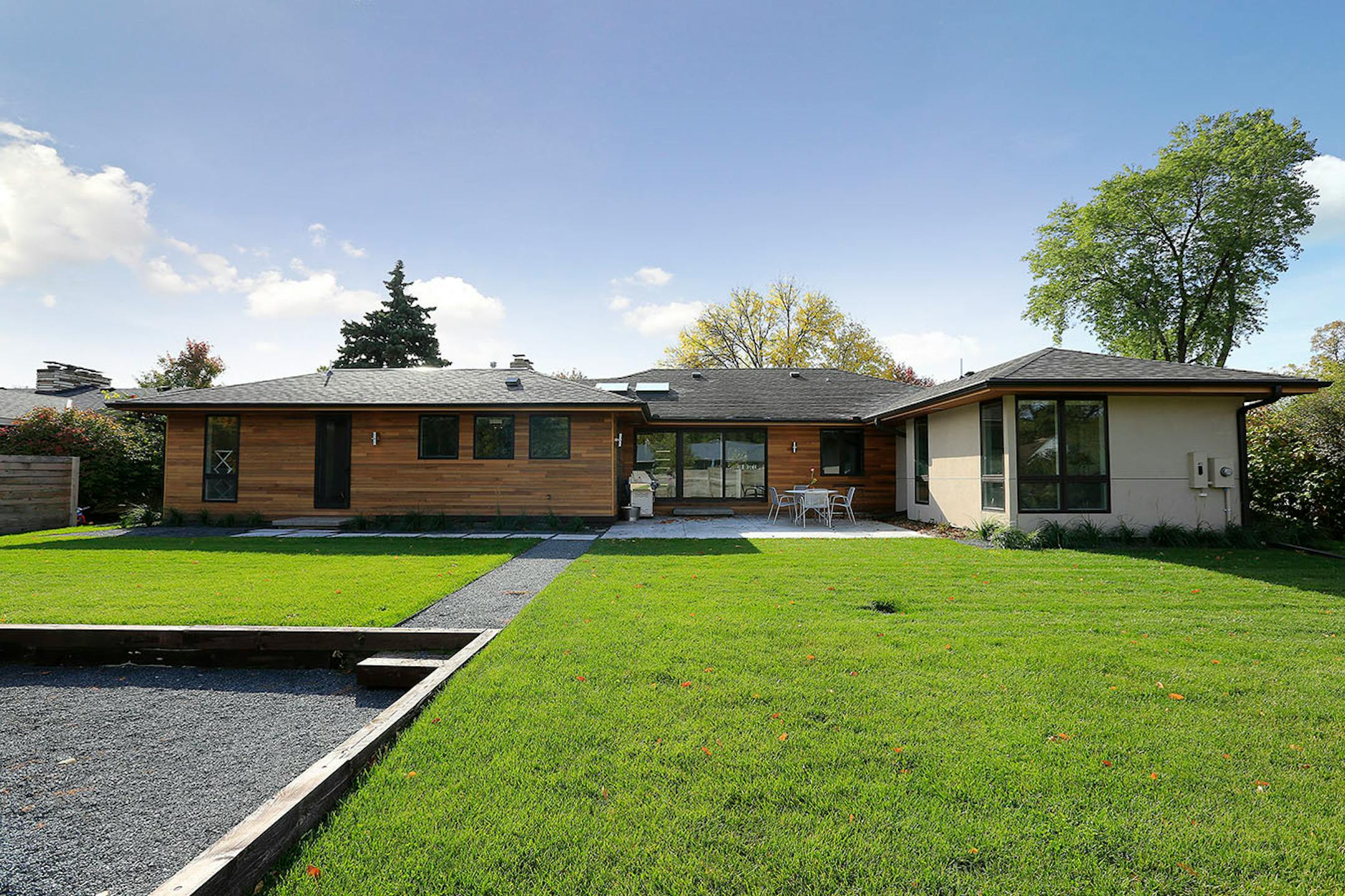 The two back-of-the-house additions: the owners' suite is on the right and the laundry and mudroom are on the far left.
