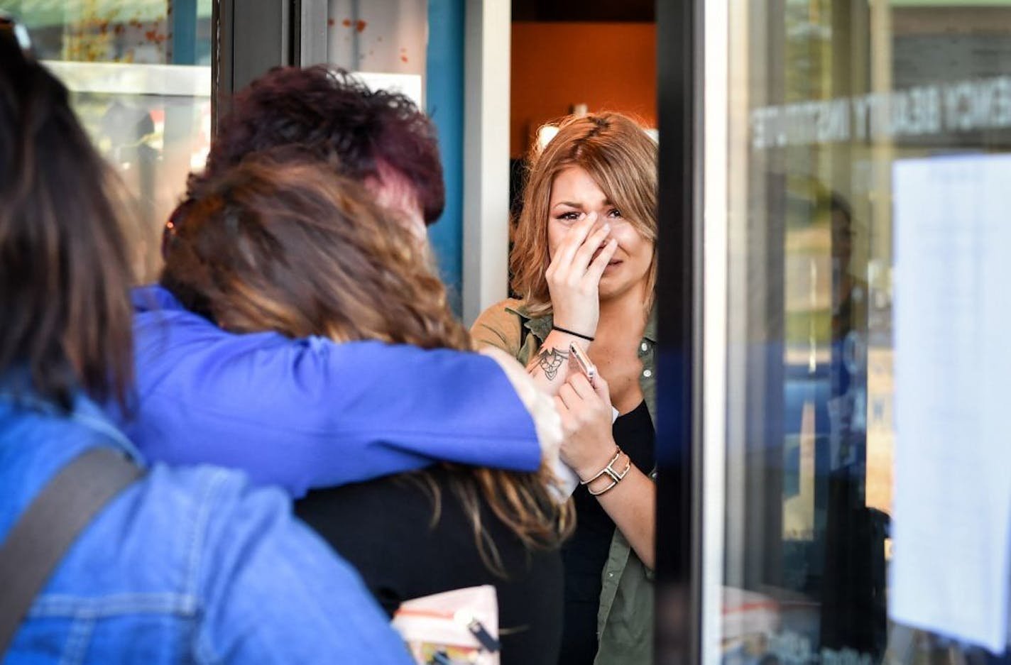 Regency Beauty Institute students hugged and cried as they picked up their personal items at the Burnsville location. The school is closing all 79 of its schools nationwide, including several in the Twin Cities.