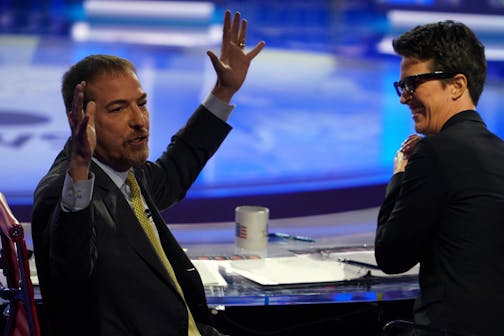 Moderators Chuck Todd and Rachel Maddow react to technical difficulties during the first Democratic presidential debate in Miami on Wednesday night, June 26, 2019.