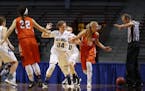Players looked on as an official made an out-of-bounds call during the 2017 state girls' basketball tournament.