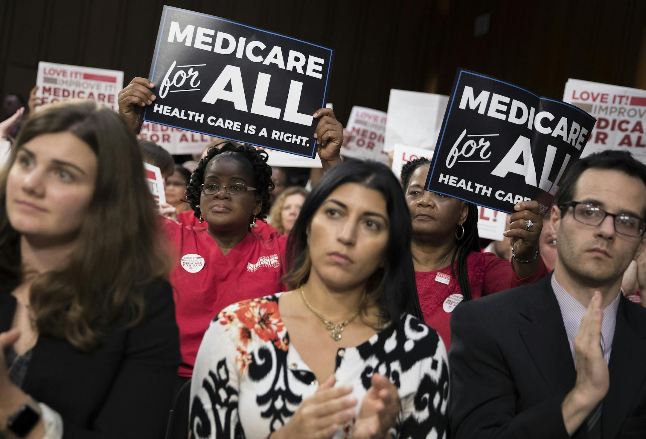 FILE — Members of National Nurses United at a speech by Sen. Bernie Sanders (I-Vt.) about health care on Capitol Hill in Washington, Sept. 13, 2017. A Medicare-for-all bill drafted by Sanders is gaining support among Democrats as they look ahead to the 2020 presidential race. (Tom Brenner/The New York Times)