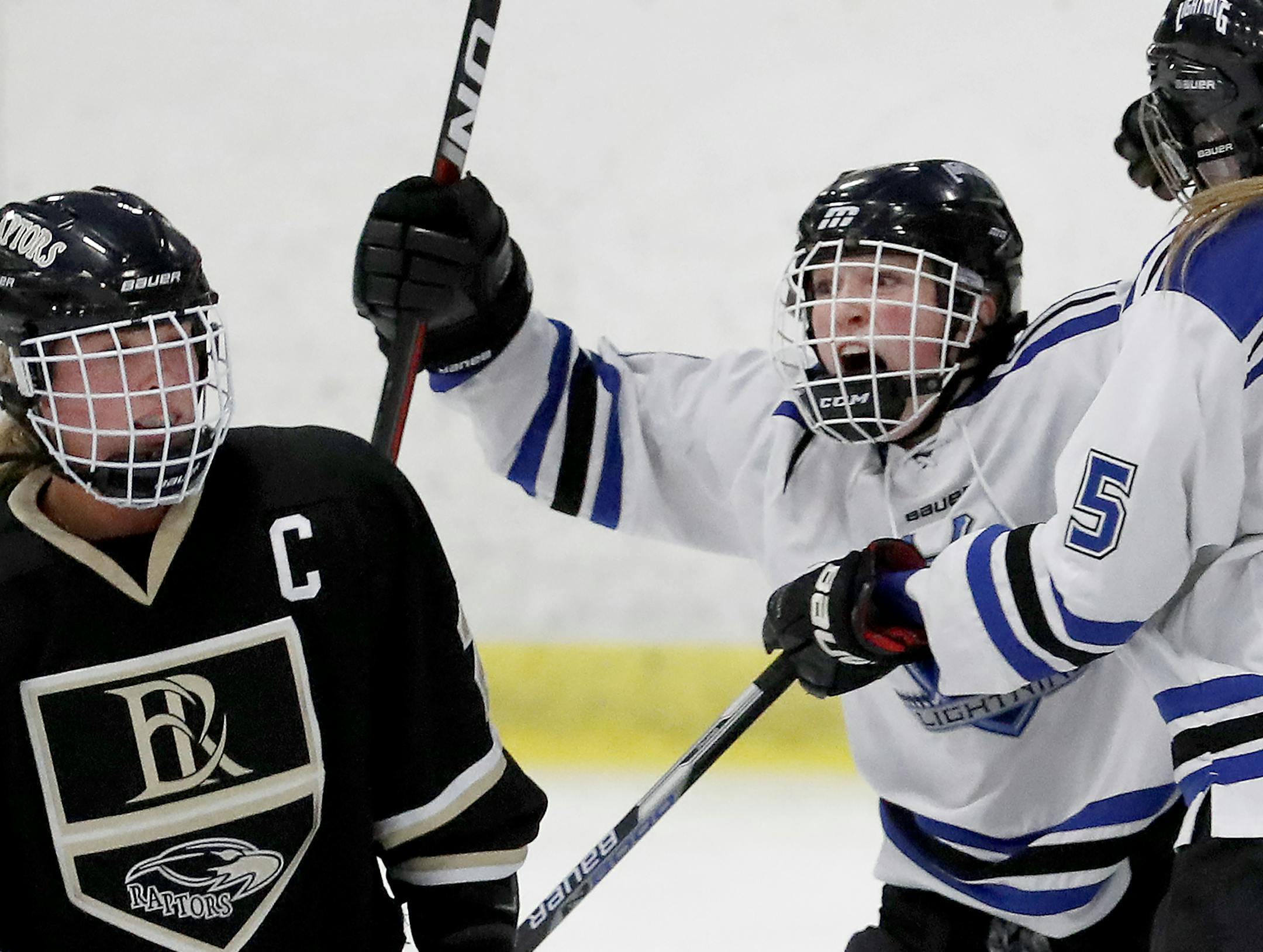 Annie Luzum (8) celebrated with Holly Sodomka (5) after scoring a goal in the third period. ] CARLOS GONZALEZ &#xef; cgonzalez@startribune.com - February 15, 2017, Inver Grove Heights, MN, Veterans Memorial Community Center, High School Girls Hockey, Class 2A, Section 3 final, Eastview Lightning vs. East Ridge Raptors