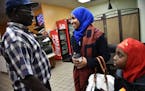 Ilhan Omar, state representative candidate for District 60B, spoke to a supporter John Kamsin after granting an interview to the Star Tribune and eati