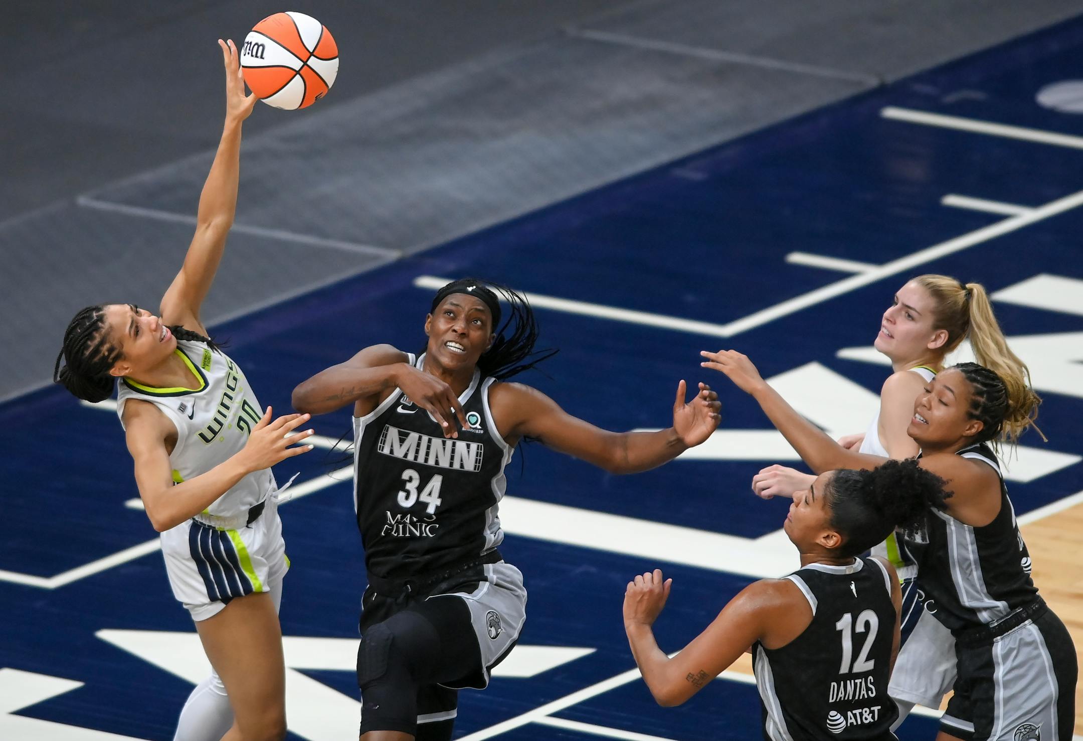 Minnesota Lynx center Sylvia Fowles (34) blocked a shot by Dallas Wings forward Isabelle Harrison (20) in the first half.