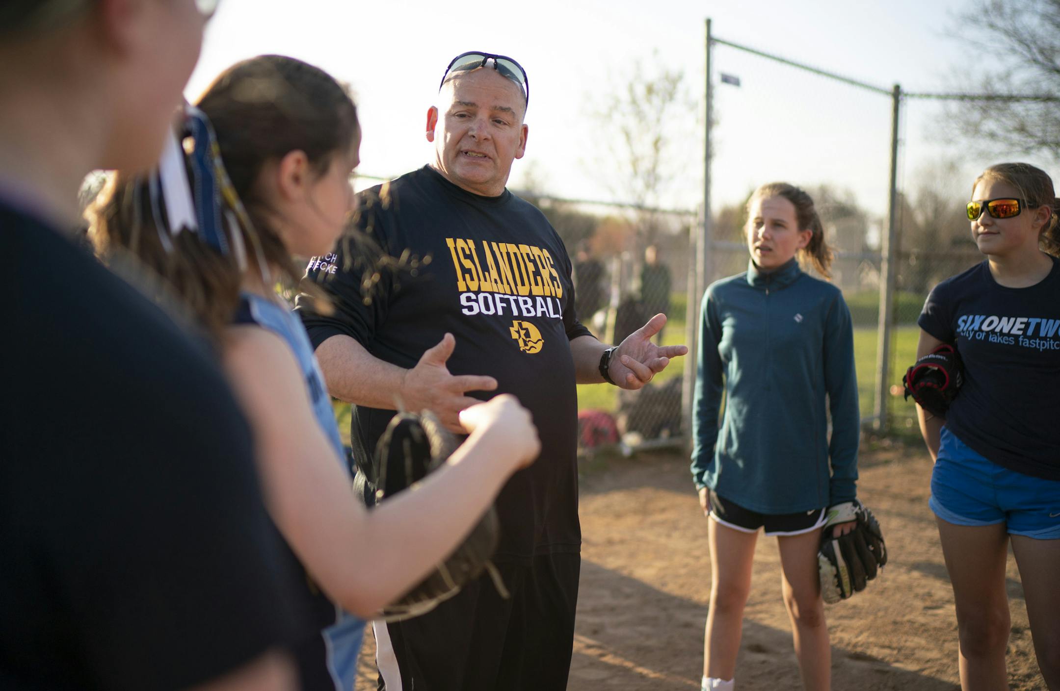 Club 612 head coach Tom Heinecke talked to the U12 team before they began a drill at practice Thursday evening. ] JEFF WHEELER • jeff.wheeler@startribune.com Like most of their suburban counterparts, Minneapolis softball players now have a club team that they can play with in addition to their high school team. Club 612's U12 team practiced at a Bryn Mawr field Thursday evening, April 25, 2019 in Minneapolis.